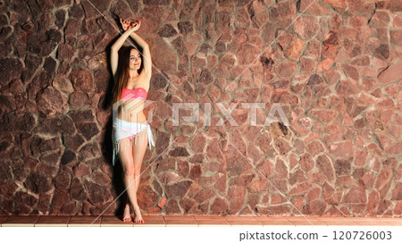 Attractive standing woman in bikini. 120726003