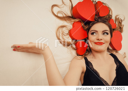 Woman in lingerie in bed. Valentines day love. 120726021