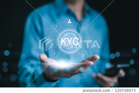 KYC verification concept. Businessman hold glowing digital representation of KYC (Know Your Customer) with compliance and security icons, symbolizing customer identity verification in business. E KYC, 120726073