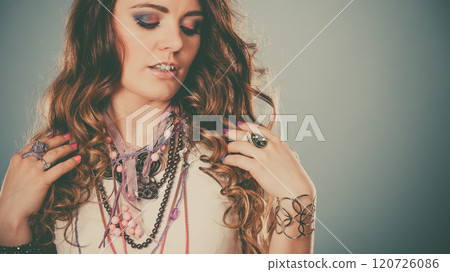 Pretty woman with jewelry necklaces ring bracelets 120726086