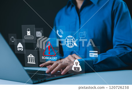 Cybersecurity concept. Scam Alert Warning, A person typing on laptop with scam alert icons, including symbols for phishing, online fraud, identity theft, Unknown person, online threats, Cyber security 120726238