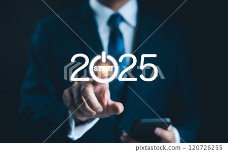 2025 start button press concept. Businessman presses digital start button integrated into the year 2025, symbolizing beginning of new opportunities, projects, and business ventures for upcoming year. 120726255