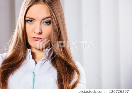 Angry and irritated business woman in office. Angry and irritated business woman in office. 120726297