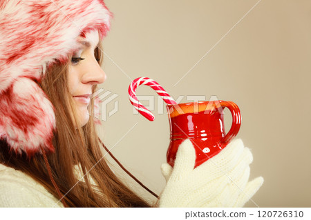 Girl with cane in xmas mug. Girl with cane in xmas mug. 120726310