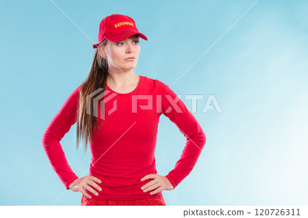 Portrait of lifeguard woman in red cap. Portrait of lifeguard woman in red cap. 120726311