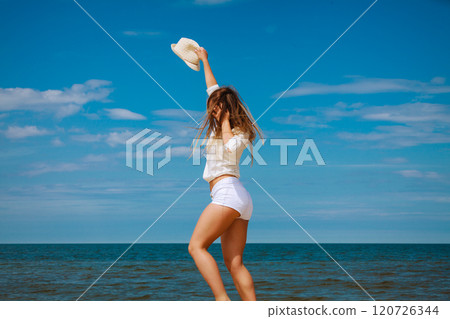 Happy woman on summer beach. 120726344