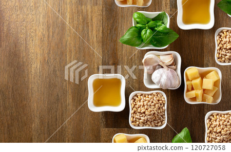 Ingredients for traditional Italian pesto on a wooden background. 120727058