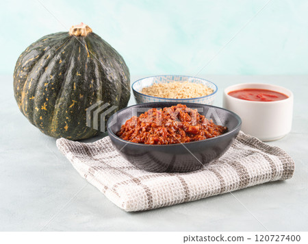 Pumpkin bolognese ragu with soya protein granules on blue background 120727400