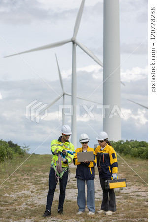 Engineer wearing safety uniform using laptop discussed plan about renewable energy at station energy power wind turbine. technology protect environment reduce global warming problems. Engineer wearing safety uniform using laptop discussed plan about renewable energy at station energy power wind turbine. technology protect environment reduce global warming problems. 120728238