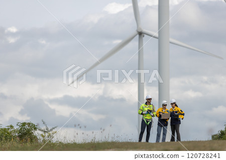 Engineer wearing safety uniform using laptop discussed plan about renewable energy at station energy power wind turbine. technology protect environment reduce global warming problems. Engineer wearing safety uniform using laptop discussed plan about renewable energy at station energy power wind turbine. technology protect environment reduce global warming problems. 120728241