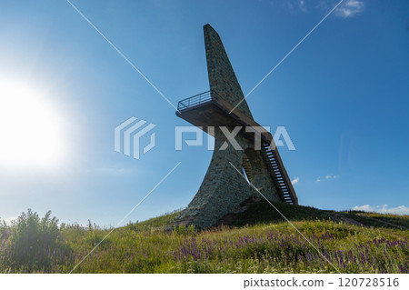 Exploring the historic monument in Armenia under a bright blue sky with lush greenery Exploring the historic monument in Armenia under a bright blue sky with lush greenery 120728516