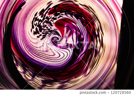 Abstract swirling patterns in vibrant colors create a mesmerizing glass art piece in a contemporary gallery Abstract swirling patterns in vibrant colors create a mesmerizing glass art piece in a contemporary gallery 120728560