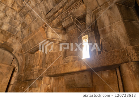 Majestic Noravank Monastery nestled among red mountains under a bright Armenian sky 120728618