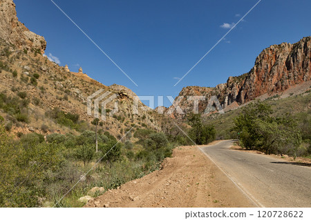 Majestic Noravank monastery nestled among the vibrant red mountains of Armenia in a clear and sunny day Majestic Noravank monastery nestled among the vibrant red mountains of Armenia in a clear and sunny day 120728622