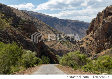 Discover breathtaking Noravank monastery nestled in Armenias stunning red mountains under a bright blue sky Discover breathtaking Noravank monastery nestled in Armenias stunning red mountains under a bright blue sky 120728623