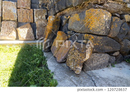Ancient stones and intricate carvings found at Sevanavank monastery in Armenia under bright sunlight Ancient stones and intricate carvings found at Sevanavank monastery in Armenia under bright sunlight 120728637