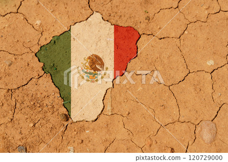 Drought. On dry, cracked ground, an image of the flag of Mexico. 120729000