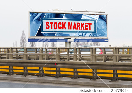 On the highway there is an advertising billboard with the image and the inscription - Stock market On the highway there is an advertising billboard with the image and the inscription - Stock market 120729064