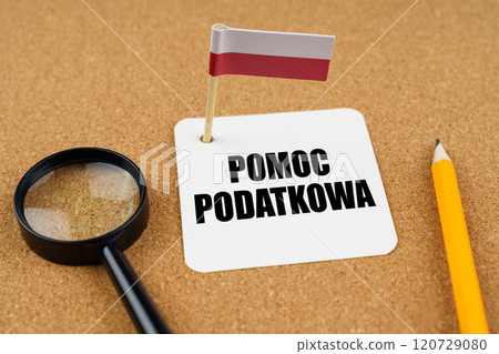 On the table is the flag of Poland, a pencil and a sheet of paper with the inscription - TAX Help 120729080