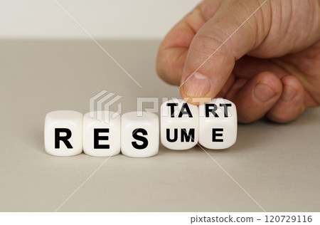On a gray surface are white cubes with the inscription - RESTART or RESUME On a gray surface are white cubes with the inscription - RESTART or RESUME 120729116