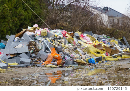 A pile of broken concrete blocks, fiberglass, plastic and other construction debris at a construction site A pile of broken concrete blocks, fiberglass, plastic and other construction debris at a construction site 120729143