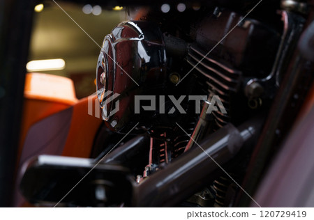 Shiny black motorcycle engine and gearbox block. 120729419