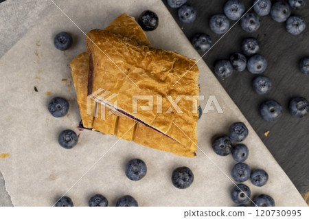 close-up of a blueberry stuffed bun with blueberries 120730995