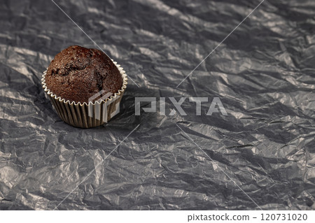 fresh and soft black chocolate cupcake on black paper 120731020