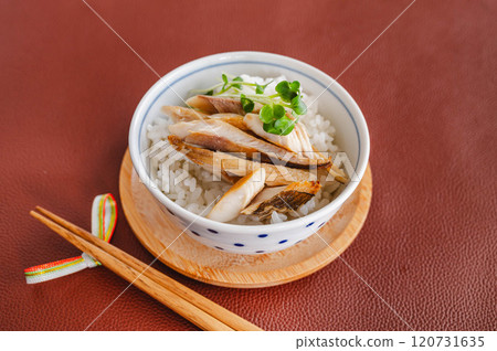Grilled flakes of Atka mackerel served on rice Grilled flakes of Atka mackerel served on rice 120731635