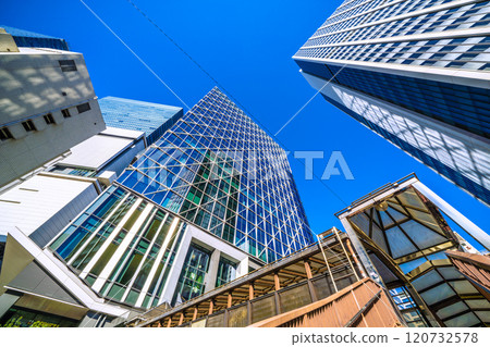 Tokyo cityscape in Japan: Shibuya Cross Tower reflected in window glass overlooking Shibuya Aqsyu and other areas = 25th 120732578