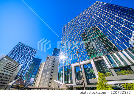Tokyo cityscape in Japan: Shibuya Cross Tower reflected in window glass overlooking Shibuya Aqsyu and other areas = 25th 120732582