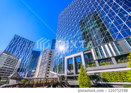 Tokyo cityscape in Japan: Shibuya Cross Tower reflected in window glass overlooking Shibuya Aqsyu and other areas = 25th 120732586