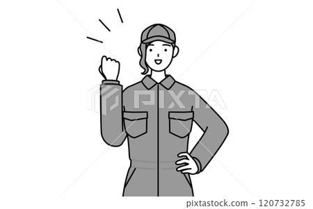 A female mechanic in overalls doing a fist pump A female mechanic in overalls doing a fist pump 120732785