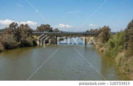 Bridge over Guadalhorce river in nature reserve Guadalhorce near Malaga in Andalusia, Spain. 120733915