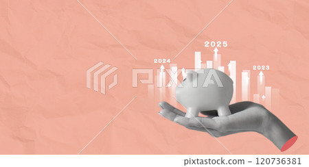 Hand holding a house model aimed at target with 2025 financial goal 120736381