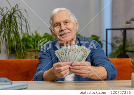 Smiling happy senior grandfather man counting money dollar cash income pension salary lottery win 120737256
