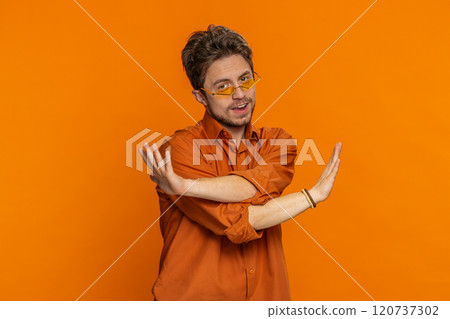 Stylish man listening music dancing disco fooling around having fun celebrating success victory Stylish man listening music dancing disco fooling around having fun celebrating success victory 120737302