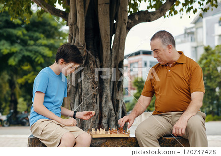 Boy Playing Chess With Granddad Boy Playing Chess With Granddad 120737428