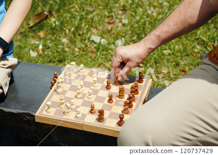 Grandfather Playing Chess With Grandson 120737429