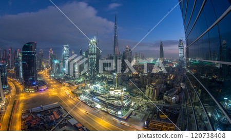 Dubai Downtown night to day timelapse. Aerial view over big futuristic city by night. 120738408