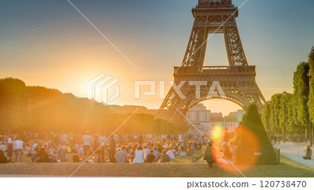 Eiffel Tower seen from Champ de Mars at sunset timelapse, Paris, France 120738470