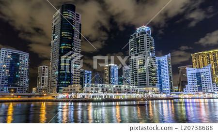 Dubai Marina towers and canal in Dubai night timelapse hyperlapse 120738688