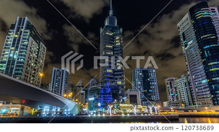 Dubai Marina towers and canal in Dubai night timelapse hyperlapse 120738689