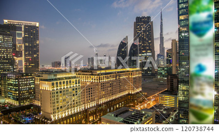 Downtown Dubai towers day to night timelapse. Aerial view of Sheikh Zayed road with skyscrapers after sunset. 120738744
