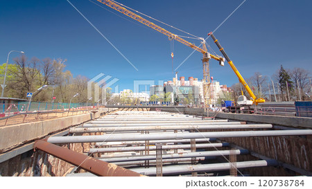 A large huge ditch pit tunnel timelapse hyperlapse at the construction site of the underground metro station line. 120738784