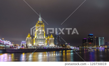 Hotel Ukraine winter night timelapse hyperlapse with bridge over Moscow River. 120738819