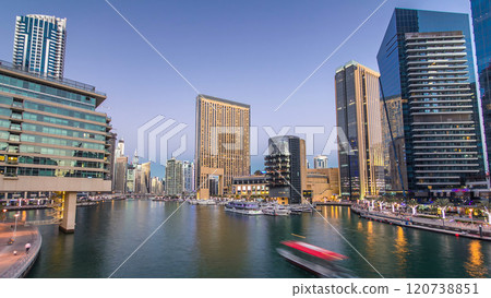 Dubai Marina towers and canal in Dubai day to night timelapse 120738851