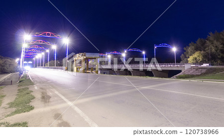 Traffic on a bridge in Uralsk night timelapse hyperlapse. 120738966