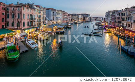 Grand Canal in Venice, Italy day to night timelapse. Gondolas and city lights from Rialto Bridge. 120738972
