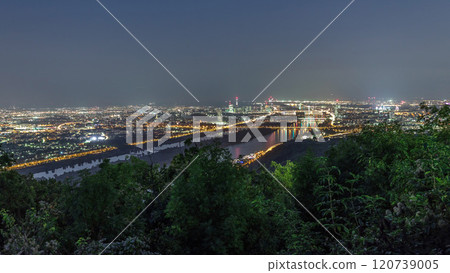 Skyline of Vienna from Danube Viewpoint Leopoldsberg aerial night timelapse. 120739005